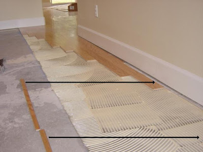 hardwood floor glue spread with trowel