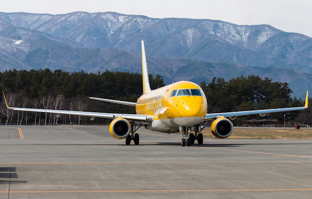 yellow fuji dream airlines embraer erj-175