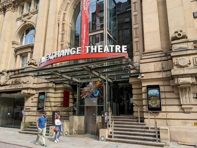 Stone building with canopy and text Royal Exchange Theatre