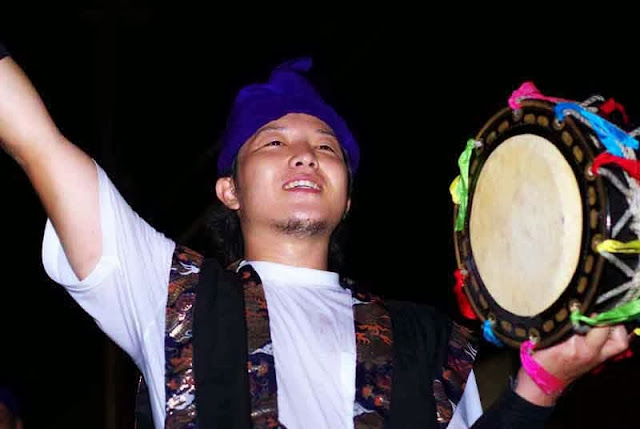 male Eisa performer with small drum