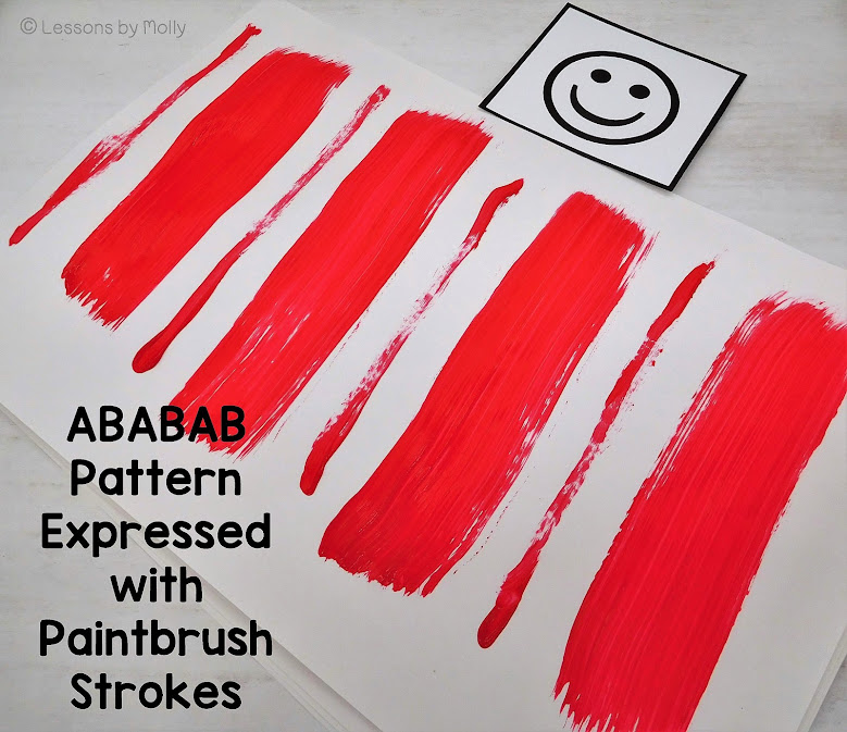 A photo of an ababab repeating pattern created with wide and thin brush strokes on paper.