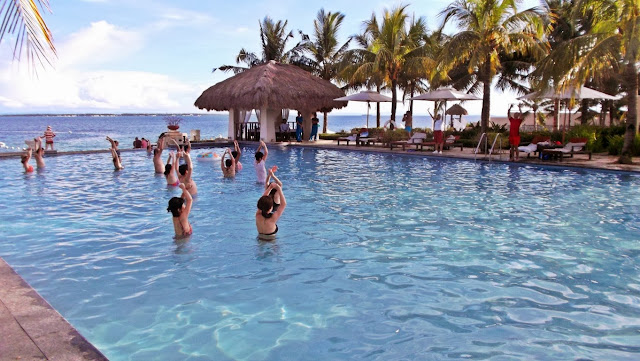 guests exercising / dancing with the instructors at the main pool of Crimson Resort and Spa in Mactan Cebu