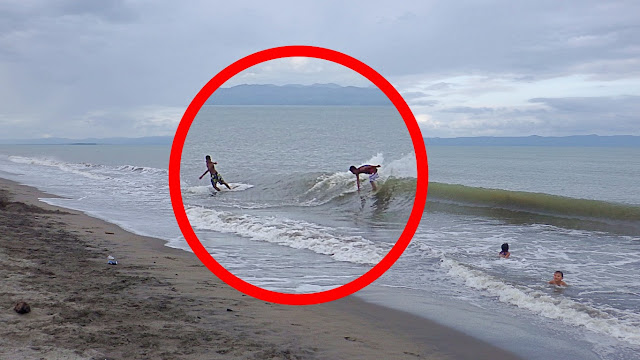 skimboarders riding it out on Red Beach Baras, Palo Leyte