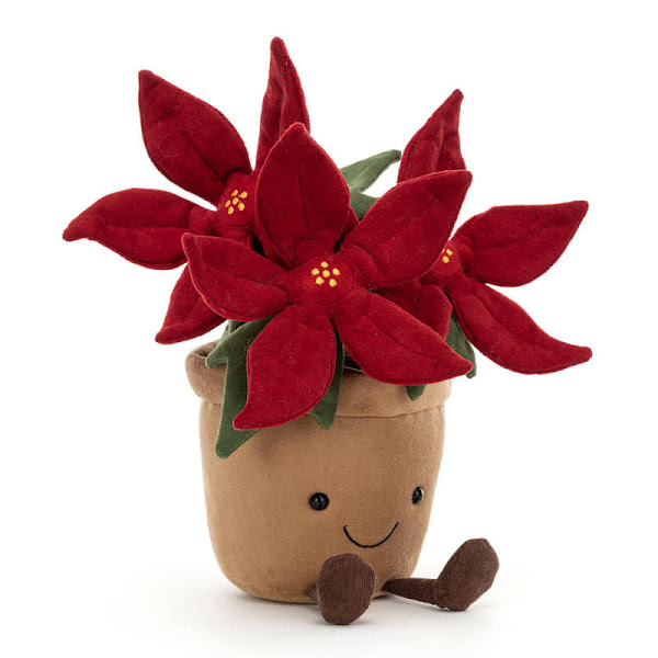 Jellycat Amuseable Poinsettia -  coming with soft, ruby-red bracts and stitched golden cyathia (the actual flowering part of a poinsettia) plus mid- green leaves, this would brighten up any dull desk or shelf, anytime of the year!
It is finished with a buff-tan coloured, soft pot, cordy legs and fluffy cocoa soil.