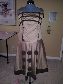 Dalek dress on a dress form with the rosettes partially applied. 