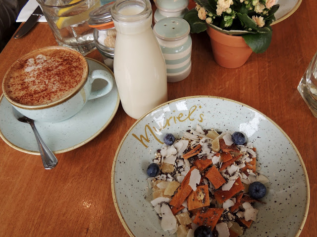 almond milk cappuccino, coconut milk and chia seed bowl with puffed quinoa and dried fruit 