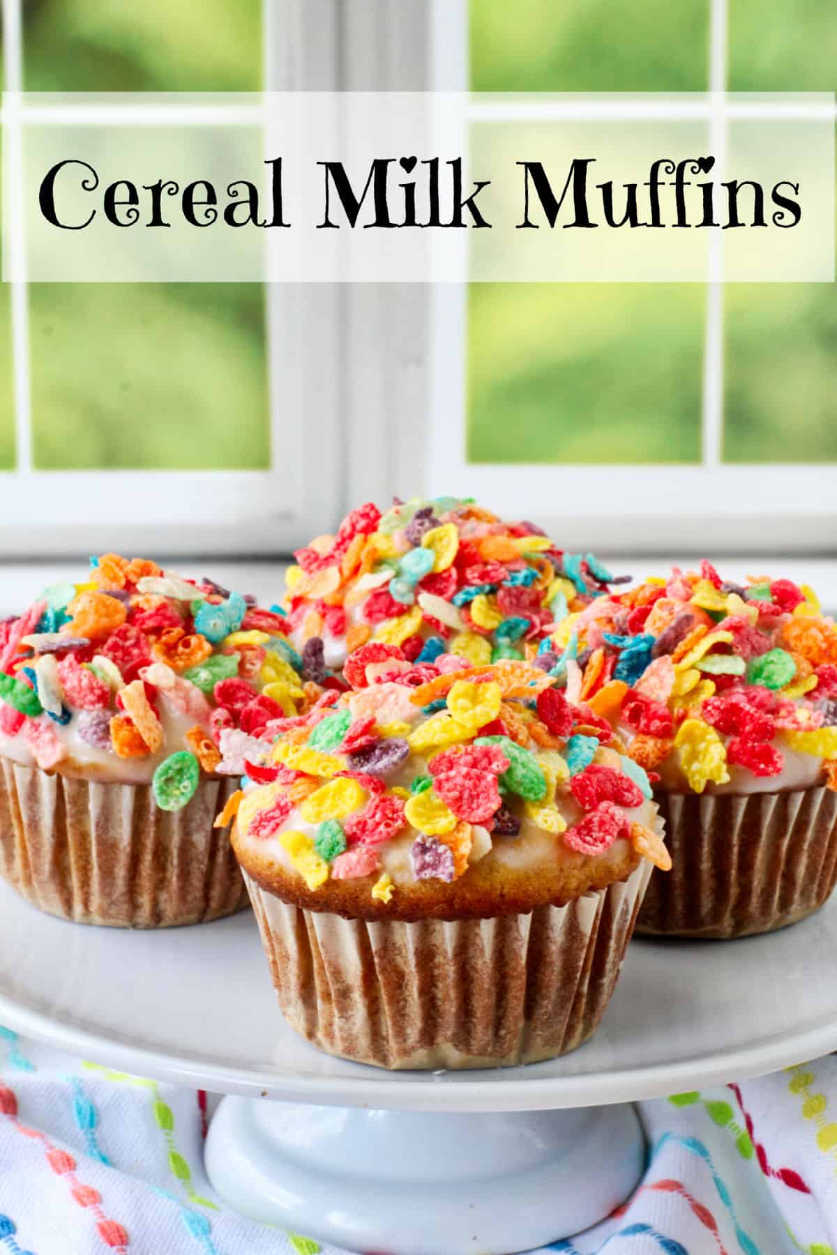 Cereal Milk Muffins on a cake stand.