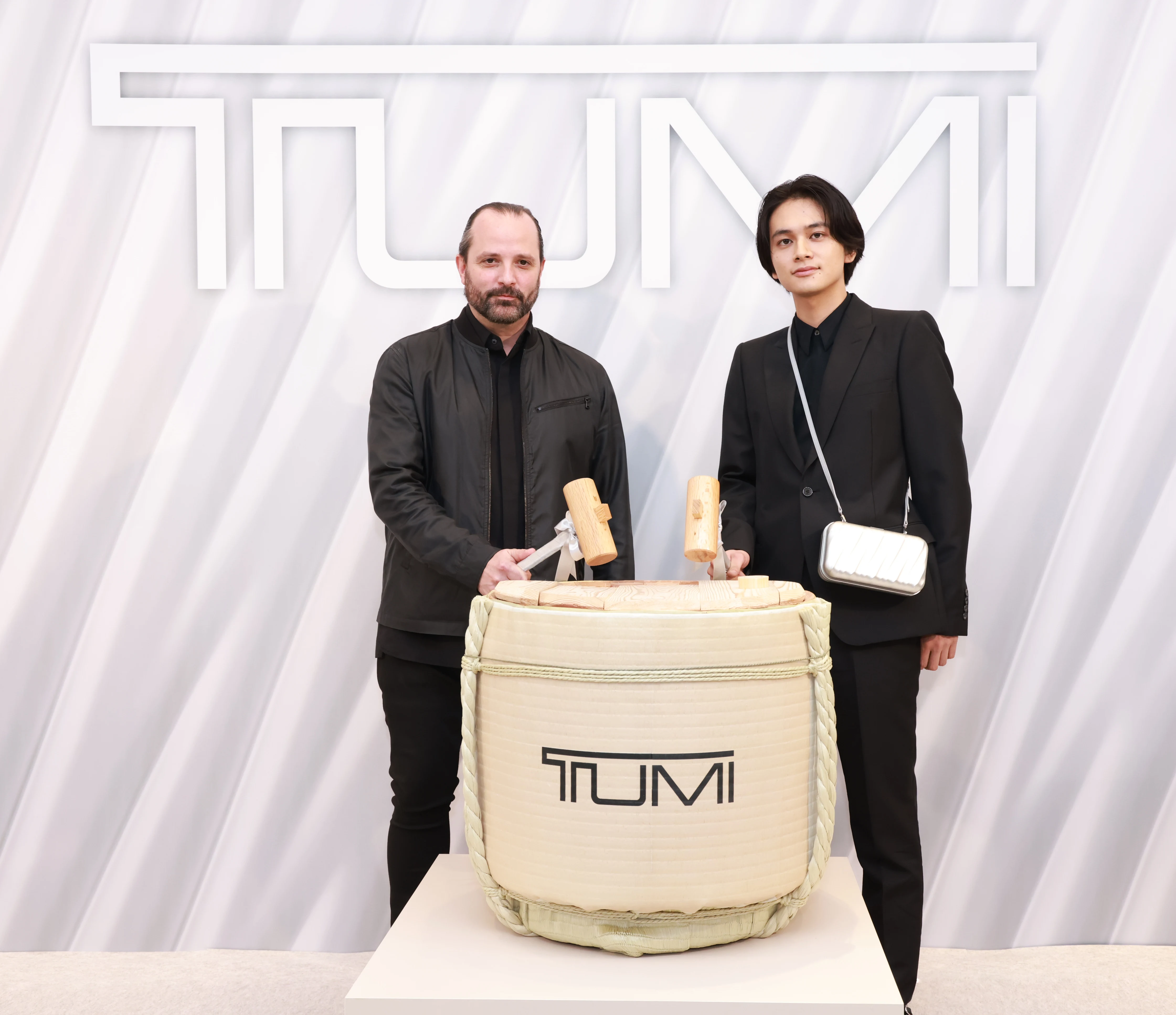 (L to R): Victor Sanz, Creative Director of TUMI and Takumi Kitamura, Japanese actor and singer, unveiled TUMI's first Asia-Pacific Flagship Store in Omotesando with a celebratory Japanese Kagami-Biraki ceremony.