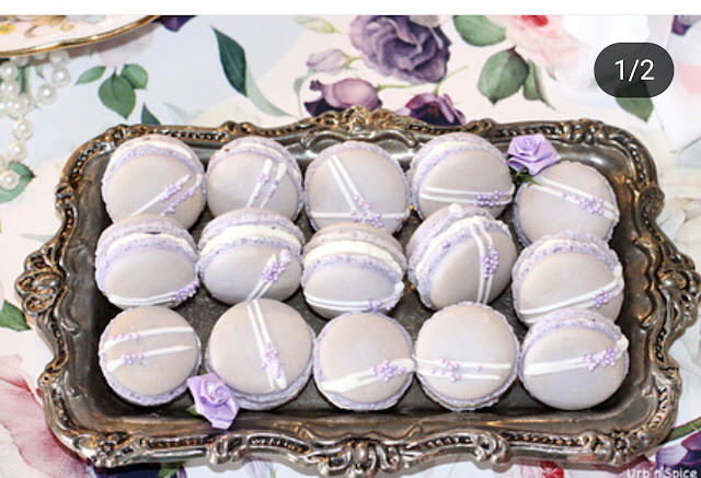 Pretty purple macarons sitting on a silver tray