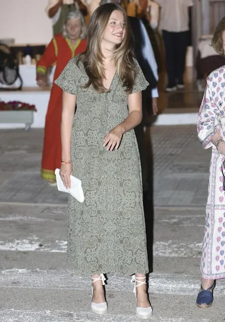 Queen Letizia wore a red pleated halter-neck dress by Mango. Infanta Sofia wore an Ikat Arles dress by Babbaki