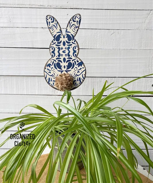 Photo of a painted & stenciled bunny shape on a stake