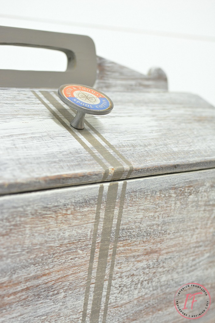 Vintage sewing box stand makeover with stenciled grain sack stripe detail.