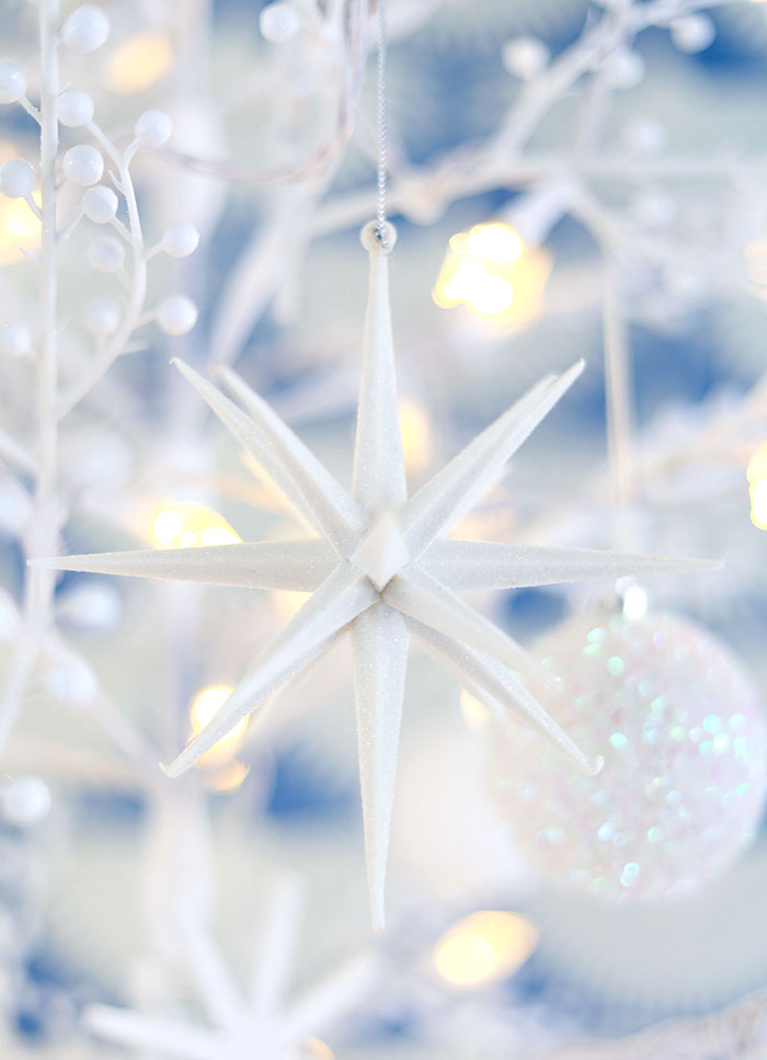 White star on white Christmas tree