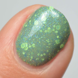 green nail polish with green and blue glitter