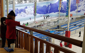 Bar and Cafe Balcony at Chill Factorᵉ overlooking slopes and snow park