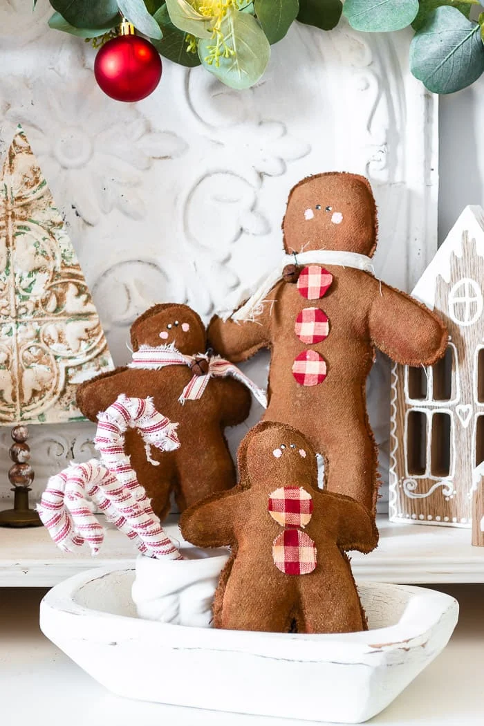 trio of gingerbread men, ticking striped candy canes, dough bowl, embossed trees