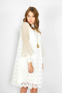 Vintage 1970's white lace long sleeved swing dress with scalloped hemline.