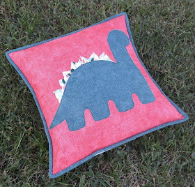 Selvage triangle dinosaur pillow