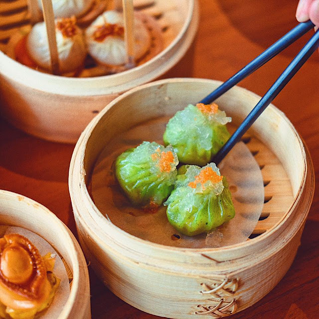 Steamed Shrimp Dumplings topped amongst Bird's Nest in addition to Tobiko