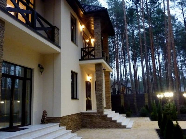 Two storey house in pine woods