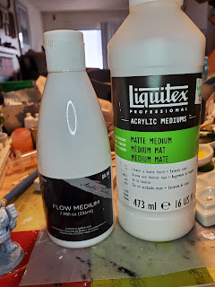 Bottles of flow improver and matte medium