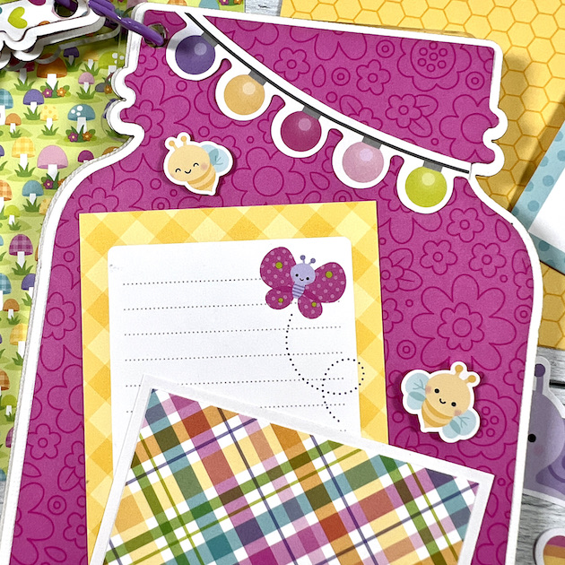 Jar shaped scrapbook page with pink flowers, butterflies, and journaling card