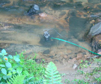 Sump pump placed in creek