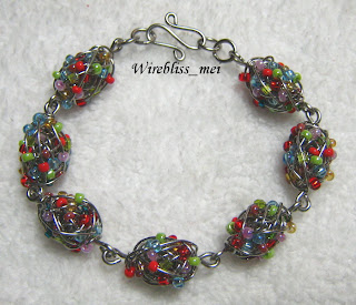 sead beads coiled with fine stainless steel wire to form beaded beads