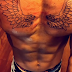  Singer Morachi shows off his new chest tattoo Fashion photos.