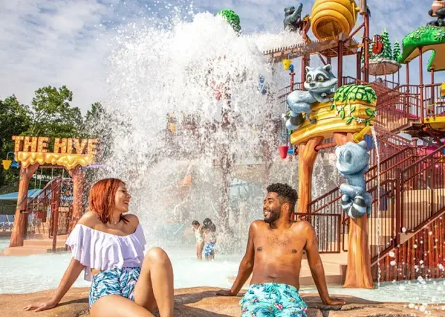 A couple in soaky mountain water park