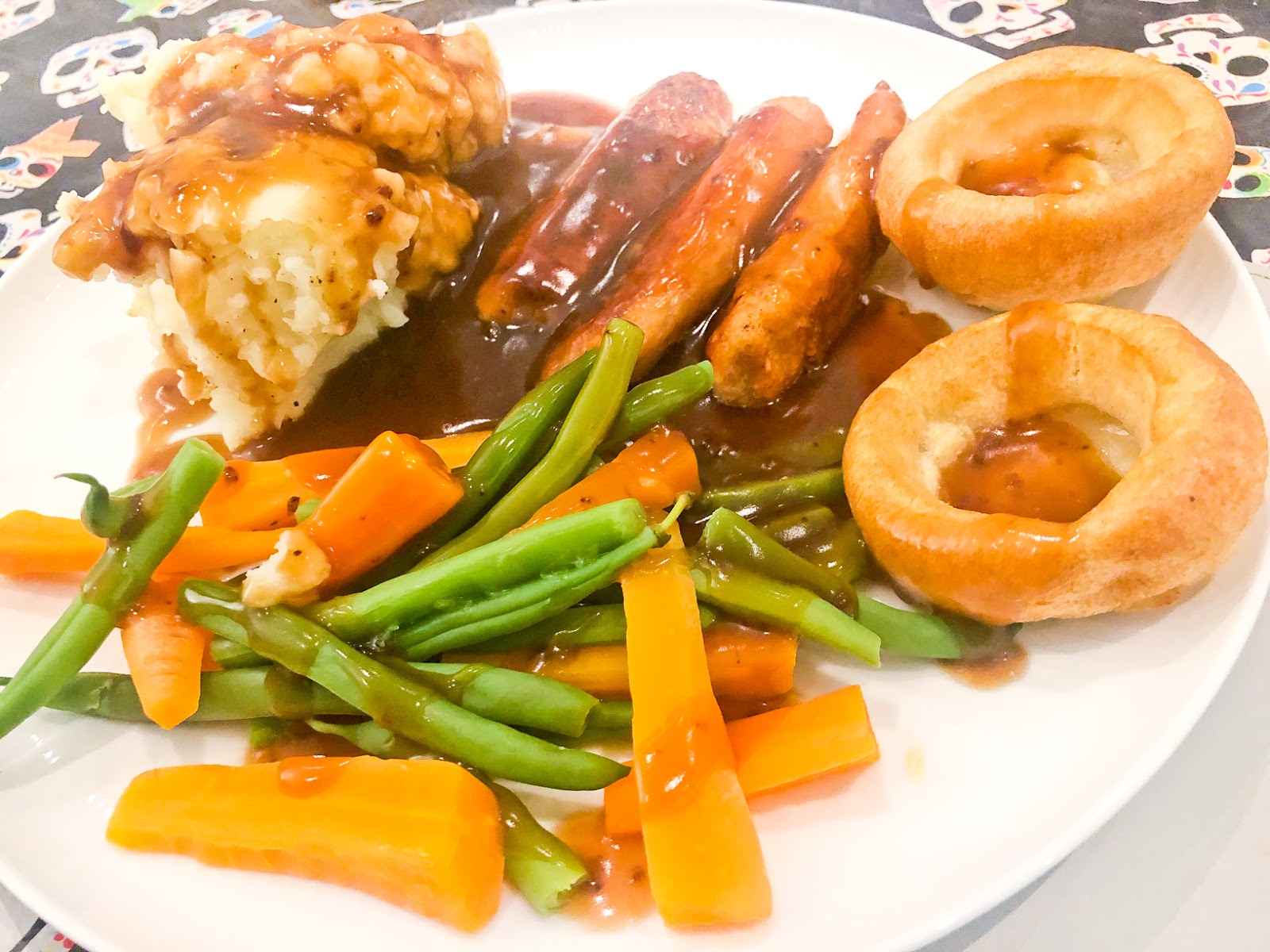 Meat-free sausages, mash and veg