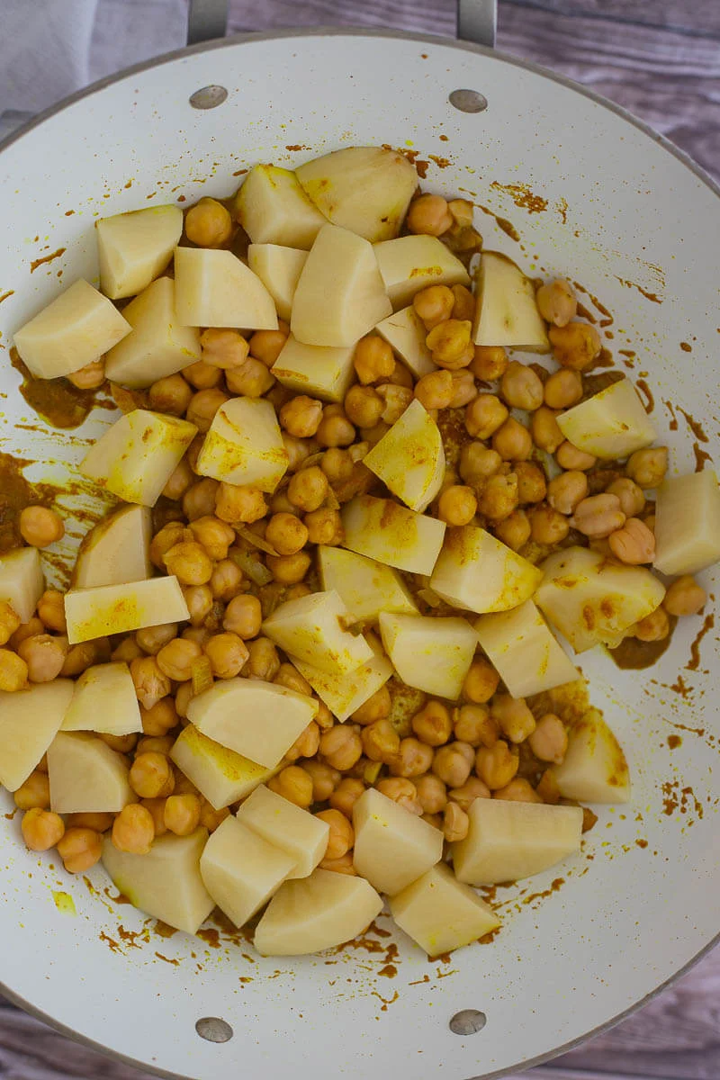 Cubed potatoes and chickpeas tossed in the curry paste mixture.