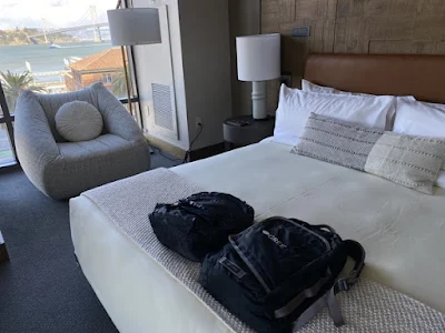 staycation backpacks on bed at 1 Hotel San Francisco in San Francisco, California