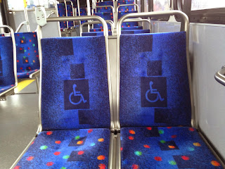 Bus seats with the wheelchair symbol in the upholstery