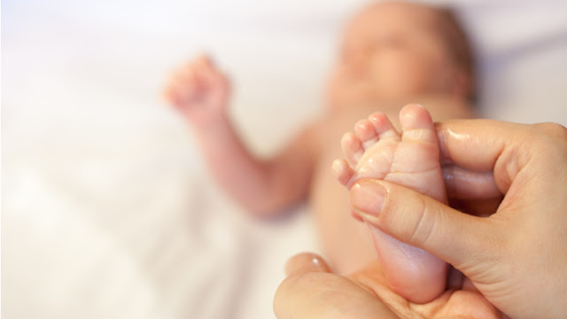 What are the benefits of giving an oil massage to a baby?