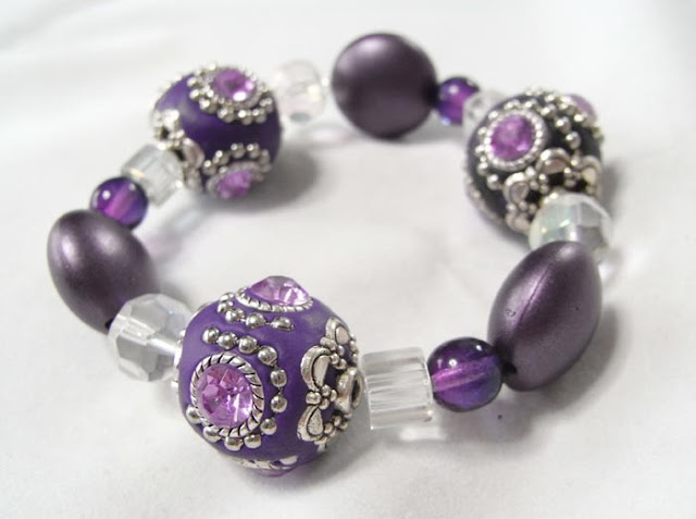 Stretch bracelet made with purple Kashmiri clay beads