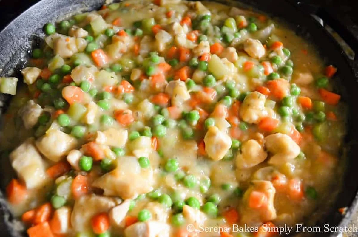 Homemade Chicken Pot Pie filling in a stainless steel pan.