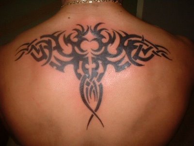 butterfly tattoos on upper back. tribal tattoo upper back.