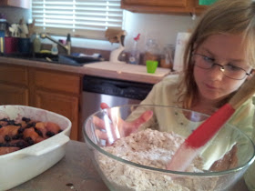 Little Miss stirring the topping for the Peach Blueberry Crisp