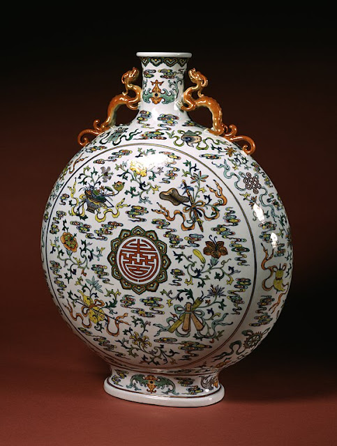 Flask with various patterns and shou character with swastikas in the center.