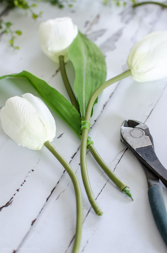 Learn the secrets behind creating a realistic flower arrangement out of fake flowers from the craft store.  Tutorial at www.andersonandgrant.com