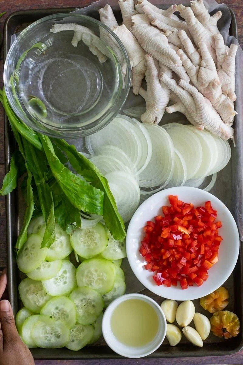 Ingredients for making chicken foot souse on a tray.