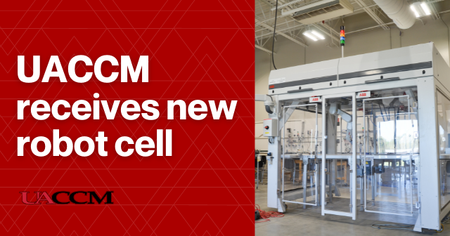 Text to the left says, "UACCM receives new robot cell." Image of the robot cell to the right.