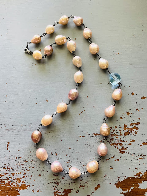 baroque pearl and blue topaz necklace by peaces of indigo on etsy