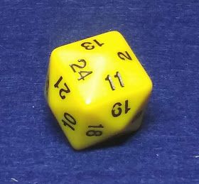 a yellow d24. In a sense, it looks like a cube, but each face has been bulged out to form four triangles, each a quarter of the side of the cube.