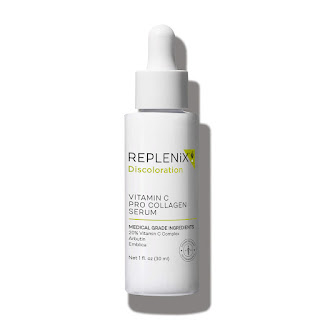 The Replenix Vitamin C Pro-Collagen Serum bottle captured in a radiant, sunlit setting that emphasizes the serum's vibrant, golden color. The dropper is poised above the bottle, ready to dispense the potent, antioxidant-rich formula designed to enhance skin firmness and luminosity.