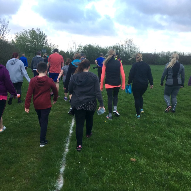 group-of-people-walking-on-grass-training-for-the-c25k-couch-to-5-k