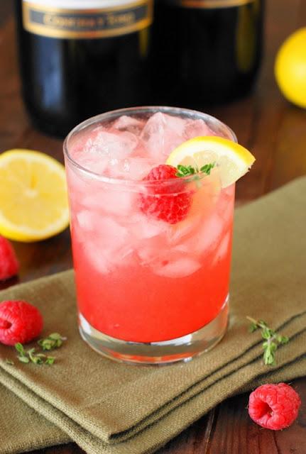 Grab your jar of honey and a few fresh raspberries to whip up this delicious pretty-in-pink Moscato Honey Bee Cocktail.  Its gorgeous pink hue would go just beautifully with Easter brunch, Mother's Day lunch, a bridal shower, or simple front porch sipping.