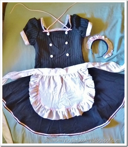 The made costume after the makeover.  The collar is gone with a pretty new lace and pink ribbon trimmed neckline.  The headband is now trimmed with ribbon and lace with a matching ribbon bow.  There is lace and pink ribbon along the skirt and more ribbon on the apron.  And no more odd gloves!