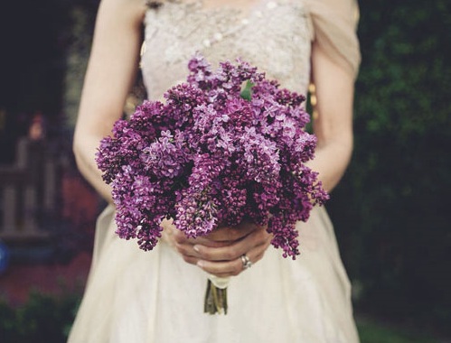 A gorgeous purple wedding bouquet from Martha Stewart including sweet peas 